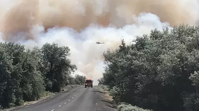 Image: Central Washington fire puts smoke cloud over Eastern Washington, fighting intensifies in Libya and other headlines