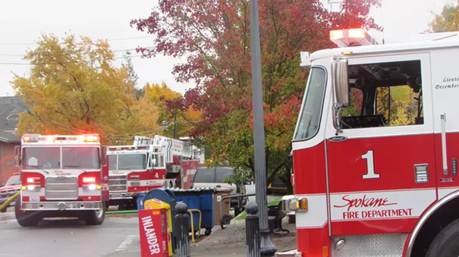 Image: And another one: City of Spokane public safety spokeswoman Michele Anderson leaves the city