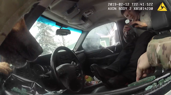 Image: WATCH: Video of controversial arrest shows Spokane Police officer shoving canine into truck with suspect