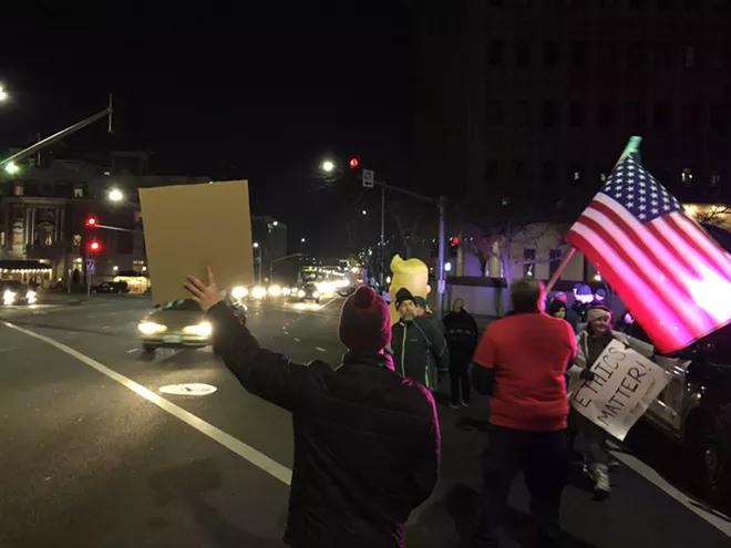 Image: Impeachment supporters gather in downtown Spokane on Tuesday night