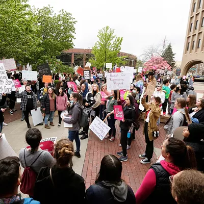 Image: A young graduate juggles potential futures in journalism or activism