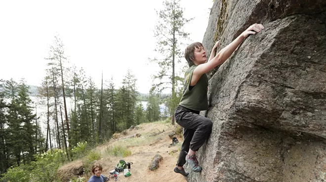 Image: An indoor rock climber tackles Tubbs Hill bouldering in Coeur d’Alene, led by local guidebook author Owen Harro