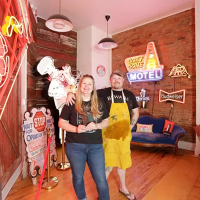 Image: Chris Bovey's relocated store is giving more space to his prints and collection of neon signage