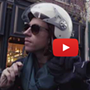 Macklemore riding a scooter in Spokane