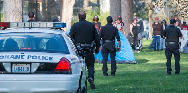 Photos from Thursday night's homeless camp police confrontation