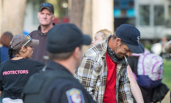 Photos from Thursday night's homeless camp police confrontation