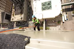 OVER THE EDGE: Rappelling down 264 feet