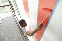 PHOTOS: Painting a logo mural at the new Inlander HQ