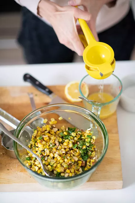 Image: Pistachio Halibut with Smoked Tomatoes and Corn Salad