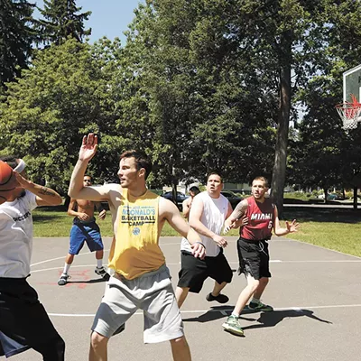 Image: Playing Basketball At Dusk