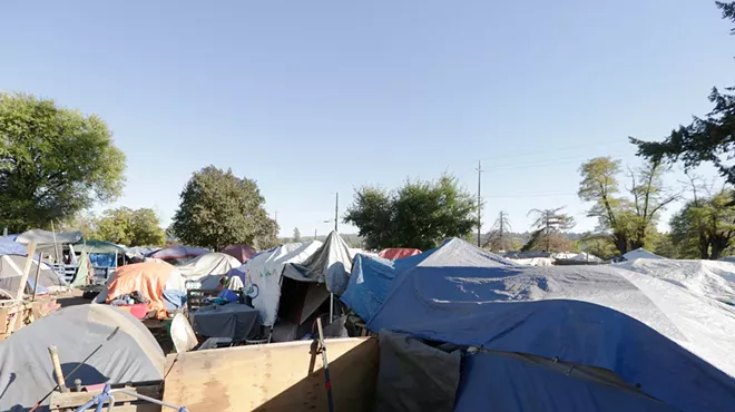 Image: Two divergent, contradictory plans will determine the future of Camp Hope. As a cold winter and the specter of sweeps loom over the camp, its residents wonder what comes next.