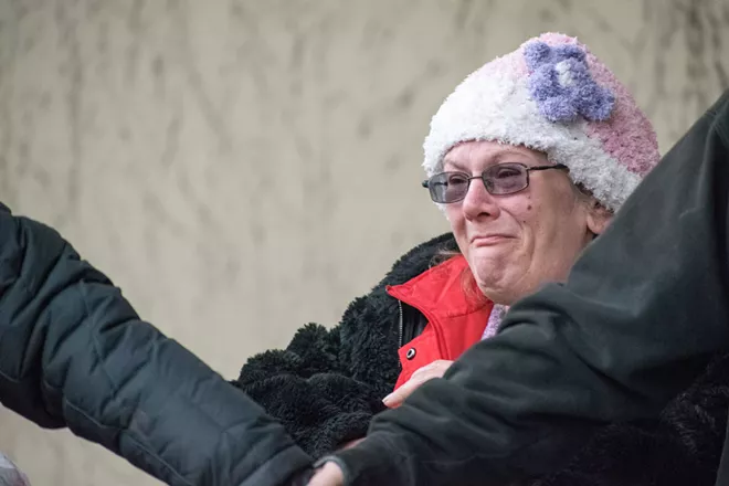 Activists form 'wall' to protect belongings of homeless outside City Hall