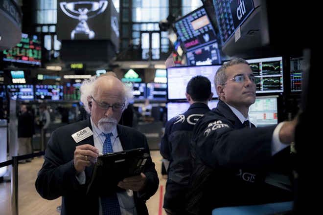 Stocks wobble as a bumpy week on Wall Street comes to a close
