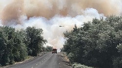 Central Washington fire puts smoke cloud over Eastern Washington, fighting intensifies in Libya and other headlines