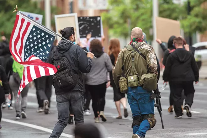 A century-old Washington state law bans private armed groups from demonstrating and the Spokane City Council wants it to be enforced