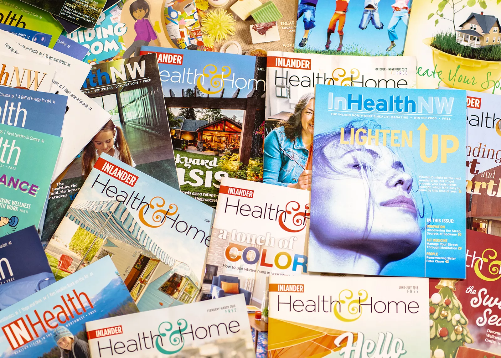 A pile of past issues of Health & Home.