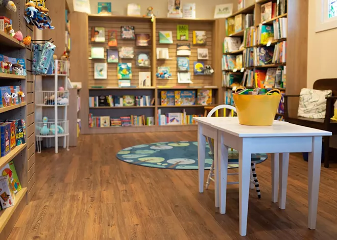 A children's area and bookshelves at Wishing Tree Books in Spokane
