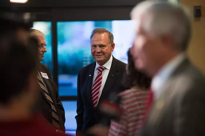 Roy Moore loses, Decapitated band members released, morning headlines