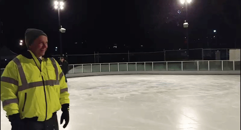 Mayor David Condon and others test out Riverfront Park's new ice-skating ribbon