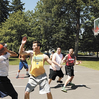 Playing Basketball At Dusk