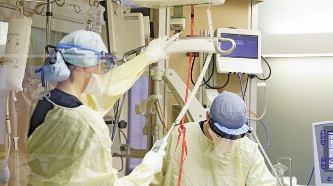 Image: With unvaccinated COVID patients swamping local hospitals, exhausted health care workers stare down death on a daily basis